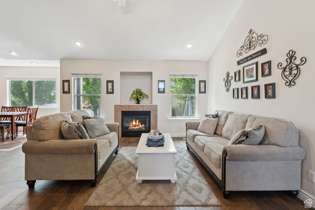 Living area with dark wood-style floors, a fireplace, recessed lighting, and baseboards | Image 8