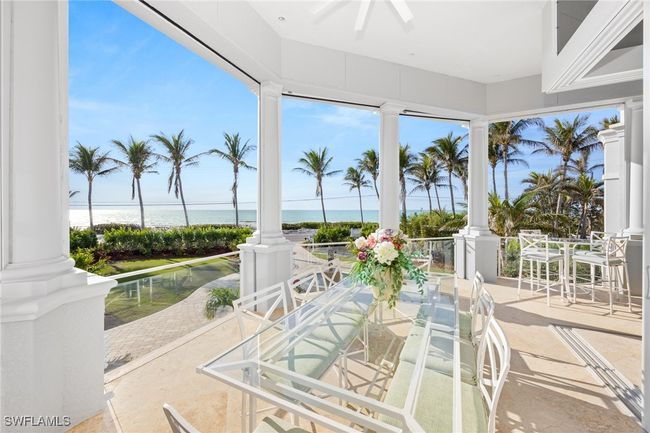 Outdoor dining on your beachfront patio with remote controlled screens | Image 15