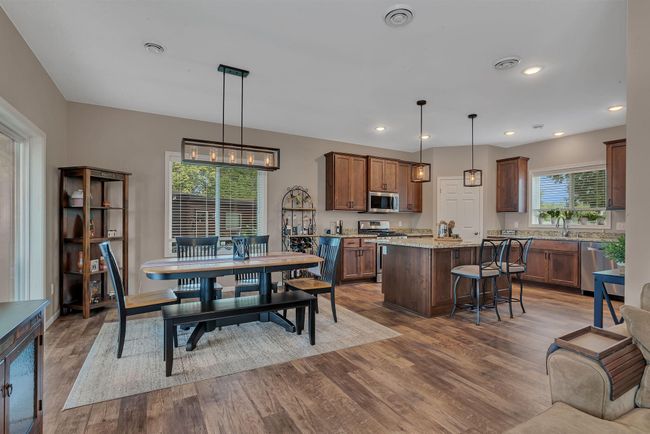 Kitchen flows nicely into the dining room - perfect for entertaining. Natural light fills the room | Image 11