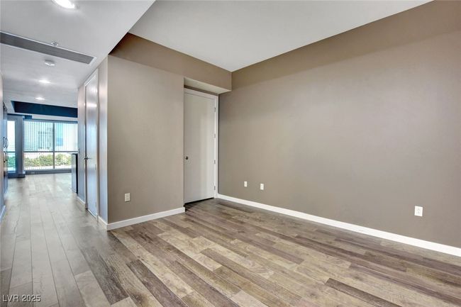 Den featuring baseboards, wood finished floors, and recessed lighting | Image 16