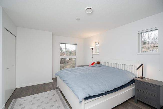 Bedroom with dark wood-style floors | Image 18
