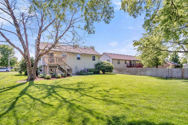 View of yard featuring stairway and a wooden deck | Image 31