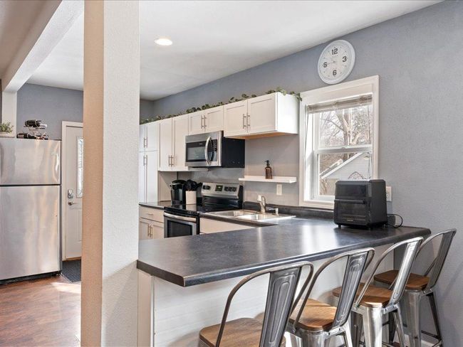 Breakfast bar style seating area | Image 7