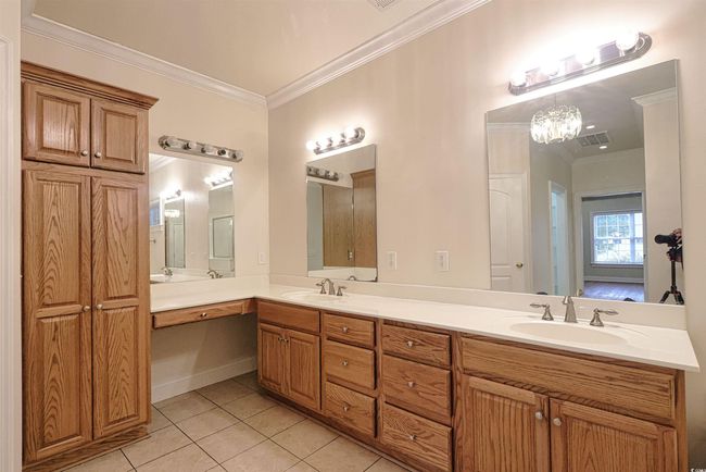 Full bath with ornamental molding, tile patterned flooring, and double vanity | Image 13