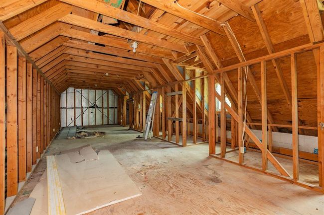 This home features a versatile third-floor attic with endless possibilities—ready to be finished for additional living space to create your dream room, office, or play area. | Image 43