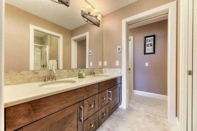 312 Boulder Creek Cres Se, House other with 3 bedrooms, 3 bathrooms and 6 parking in Langdon AB | Image 27