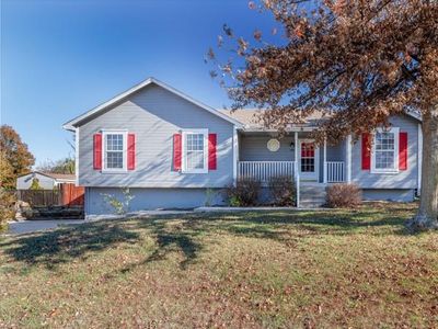 View of front of home featuring covered porch and a front yard | Image 1