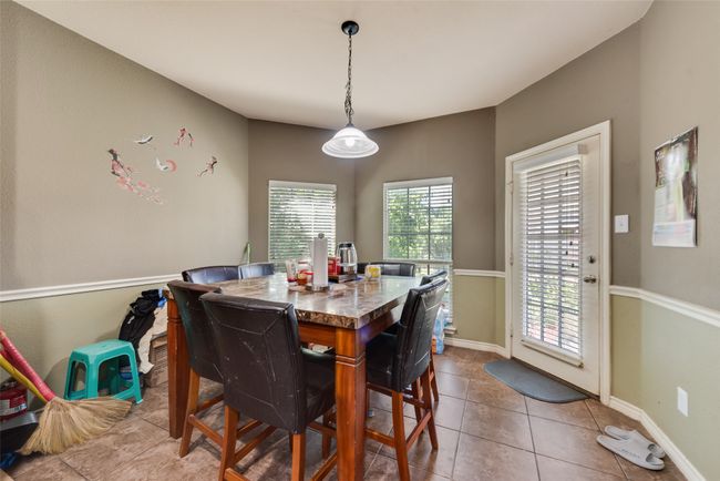 Tiled dining room featuring baseboards | Image 13