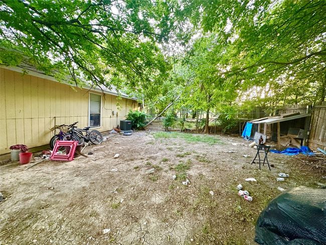Fenced backyard featuring cooling unit | Image 19