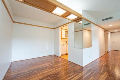 Formal dining room off kitchen and living room. Premier flooring throughout both rooms. | Image 3