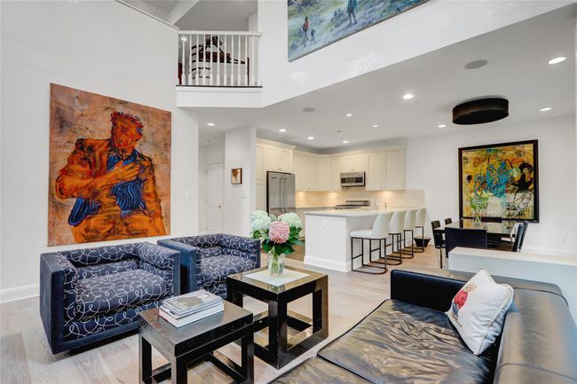 Living room featuring recessed lighting, a towering ceiling, and light wood finished floors | Image 5