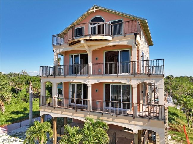 Drone / aerial view featuring a water view and a beach view | Image 5