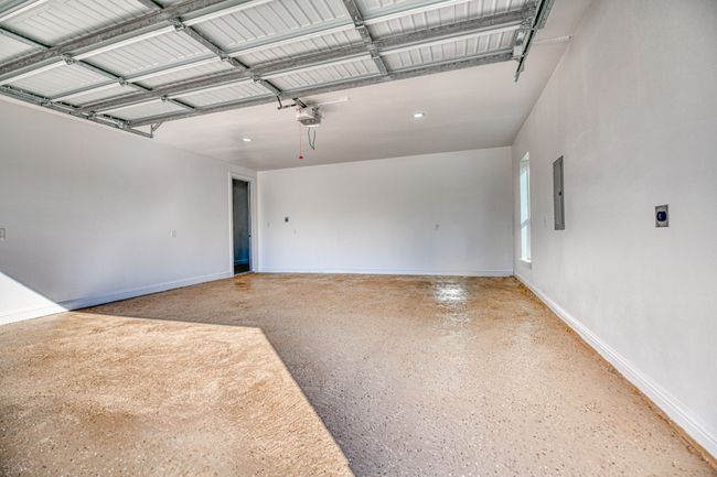 Garage with electric panel and a garage door opener | Image 38