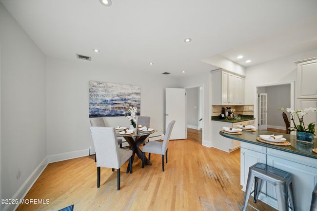 Eat in Kitchen with separate Dining, Coffee bar, SS appliances with sliders to LARGE deck with privacy and nature. | Image 12