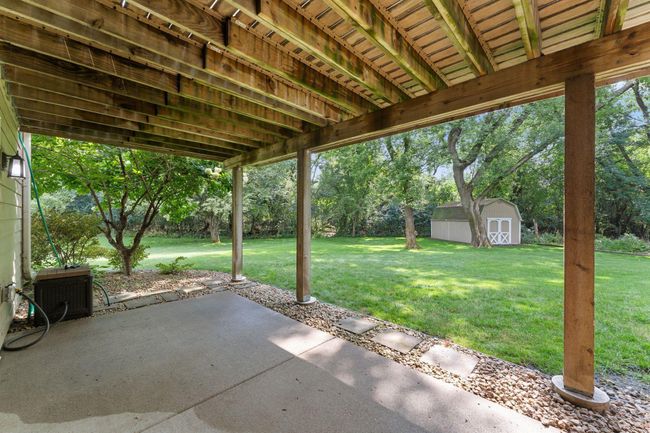 Enjoy shade on the covered backyard patio. | Image 34