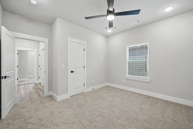 Unfurnished bedroom with baseboards, visible vents, recessed lighting, and carpet | Image 13