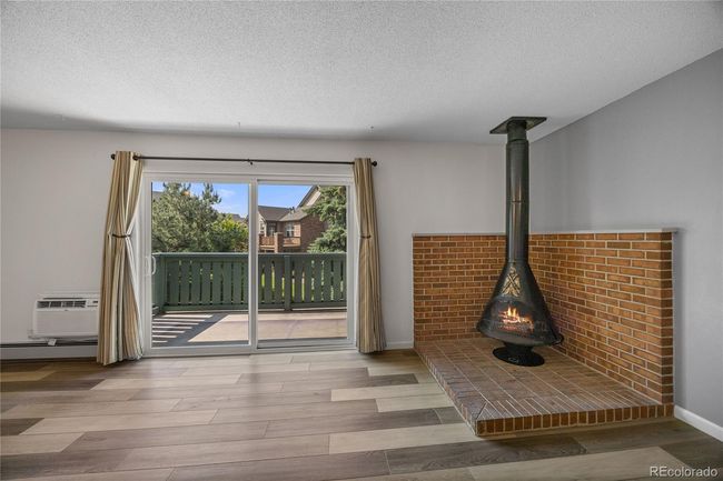 Living room with wood burning fireplace | Image 9