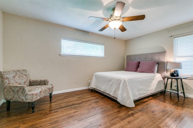 Primary Bedroom with wood floors, room for a sitting area, and ceiling fan | Image 13