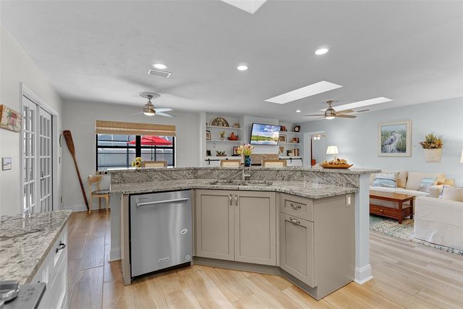 Kitchen includes an Island with a Breakfast Bar, perfect for those quick meals or Entertaining | Image 14