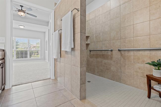 Shower with grab bars to provide safety and support. | Image 11