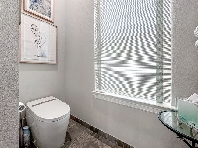 Bathroom featuring toilet and baseboards | Image 35