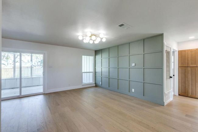 Unfurnished room with baseboards, visible vents, and light wood finished floors | Image 11