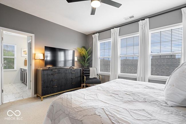 Primary Suite that offers a ensuite bathroom and custom closet | Image 19