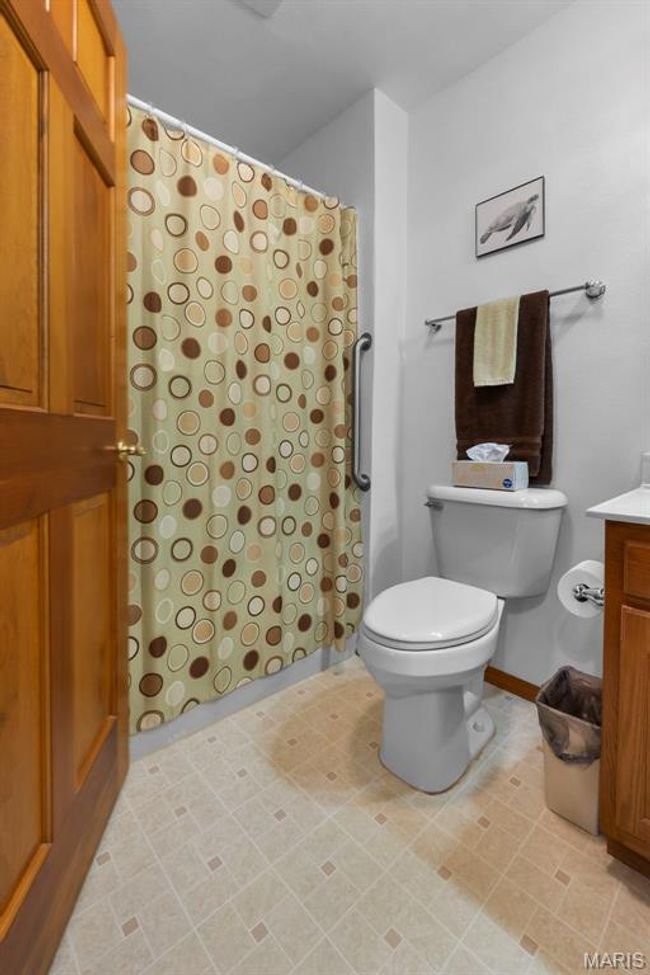 Bathroom featuring vanity and a shower with shower curtain | Image 75