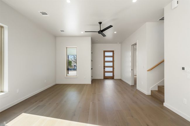 Entrance foyer featuring baseboards, visible vents, stairway, light wood-style floors, and recessed lighting | Image 5