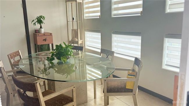 Dining space with healthy amount of natural light and baseboards | Image 4