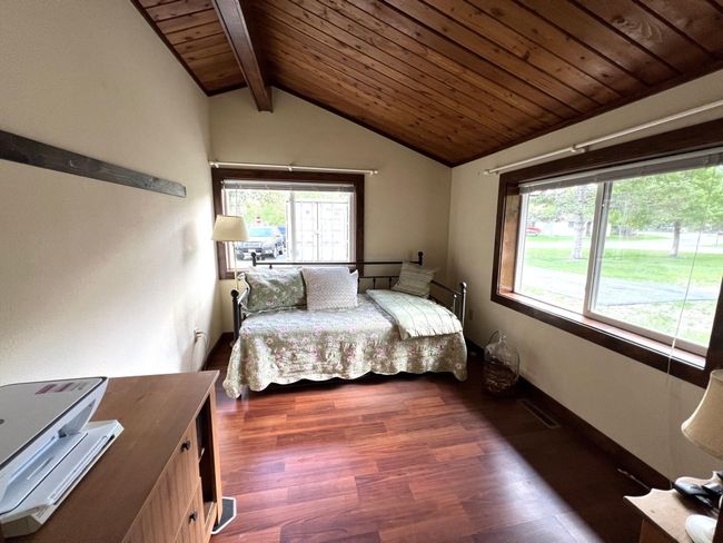 Nice sized 2nd bedroom with lots of light and natural wood accents | Image 31