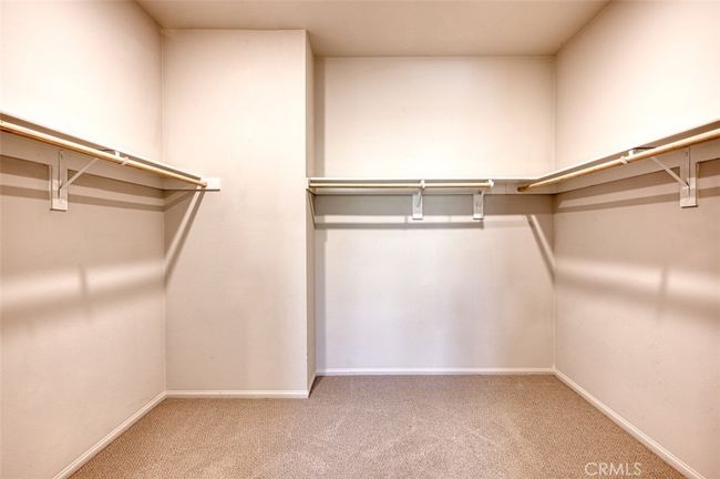 Owner's suite includes a generous walk-in closet. | Image 20