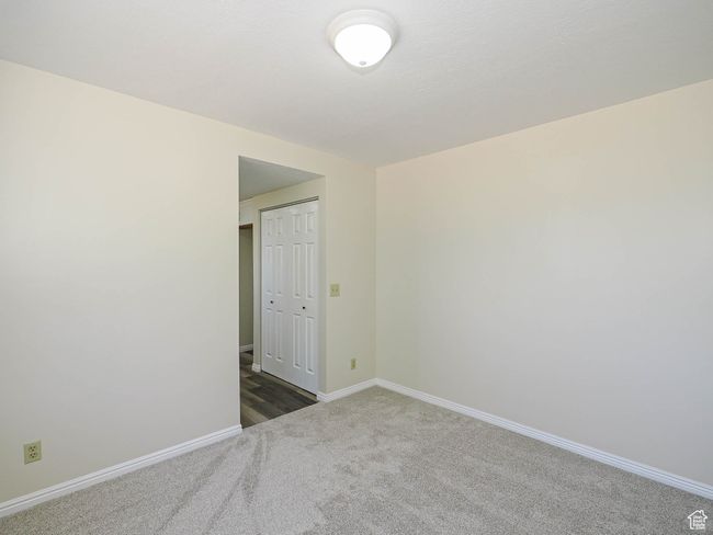 Carpeted spare room with baseboards | Image 34
