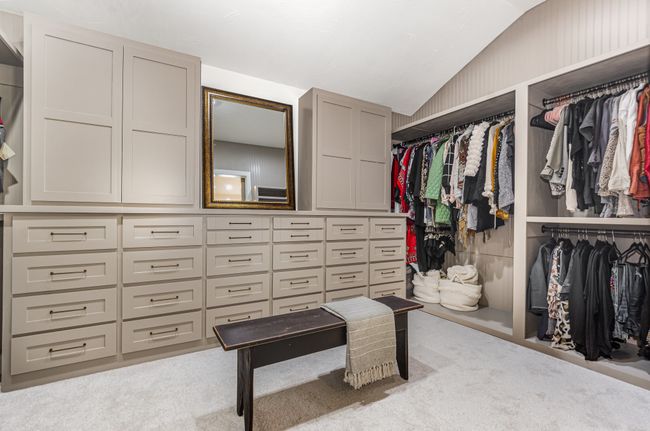 Walk in closet featuring vaulted ceiling and carpet floors | Image 21