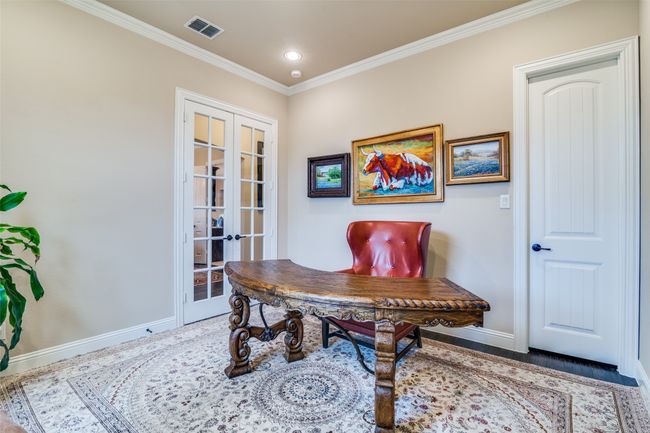 Office space is spacious and has recessed lighting, trim work and handscraped hardwood flooring. | Image 9