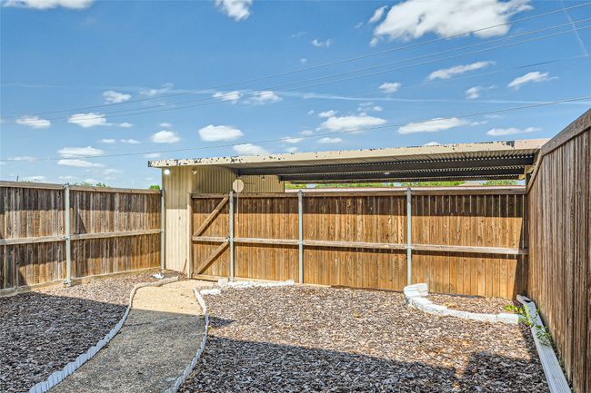 View of fenced backyard | Image 25