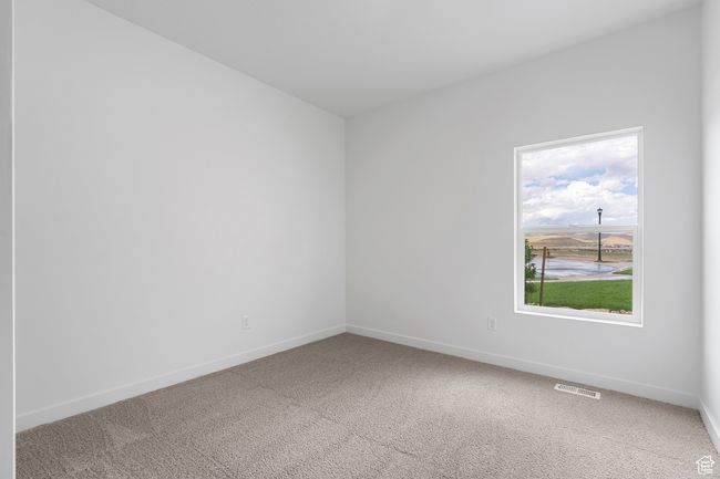 Unfurnished room with visible vents, baseboards, and carpet floors | Image 12