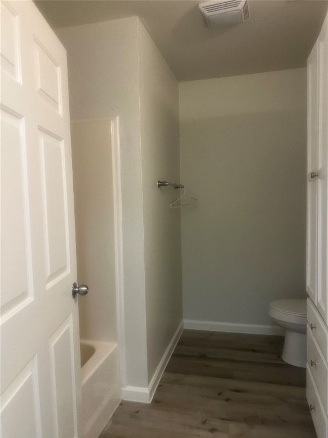 Bathroom with wood finished floors | Image 12