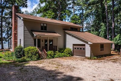 Front of property with a garage and covered porch | Image 2