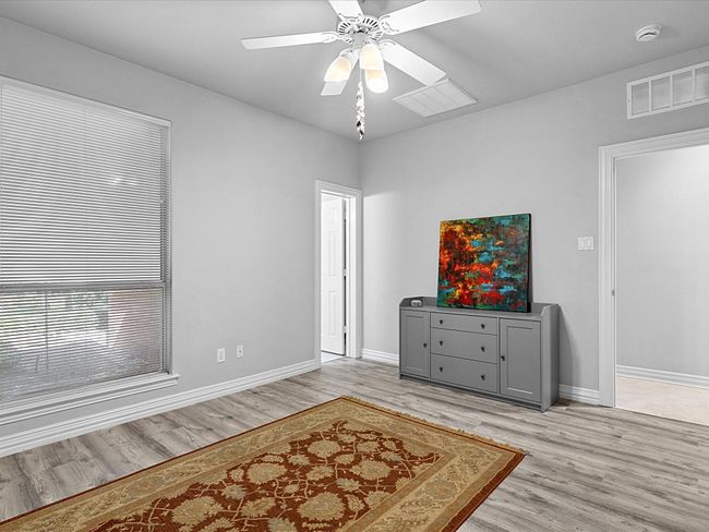 1st floor bedroom. Entrance to bathroom on left. | Image 16