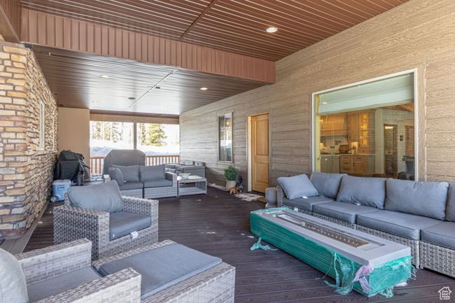 Wooden terrace with an outdoor living space | Image 46