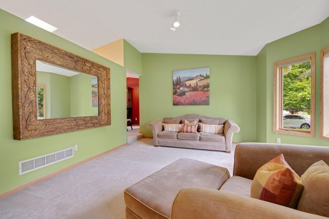 Positioned near front door, kitchen and dining room. | Image 10