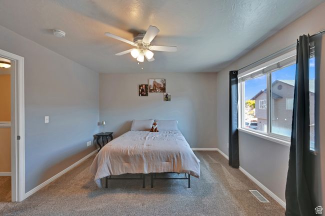 Bedroom with carpet floors and ceiling fan | Image 16