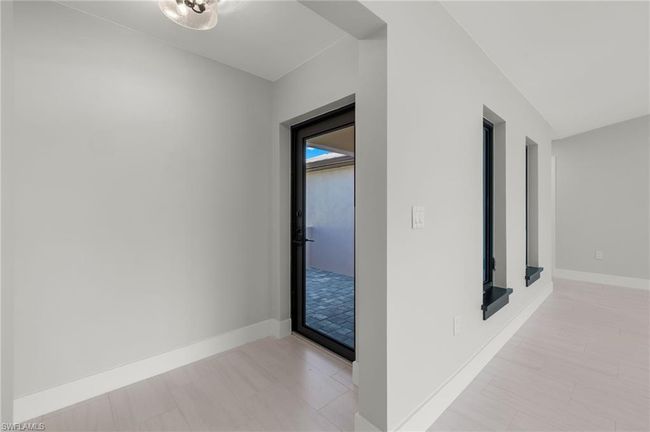 Hallway featuring light tile patterned floors | Image 13