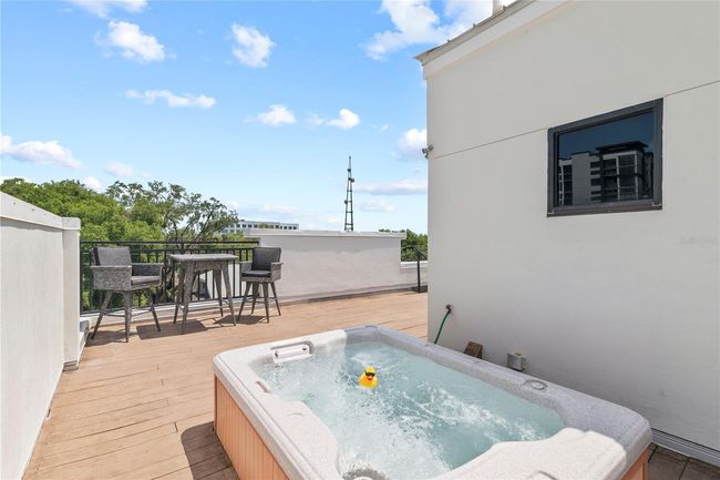 HOTTUB [with rubber duck] IN FOREGROUND WITH SEATING AREA IN BACKGROUND | Image 6
