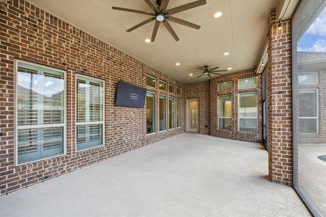 Covered patio with ceiling fans. | Image 27