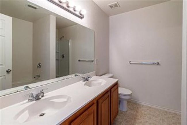 Full bathroom with a shower, double vanity, and a bathtub | Image 10