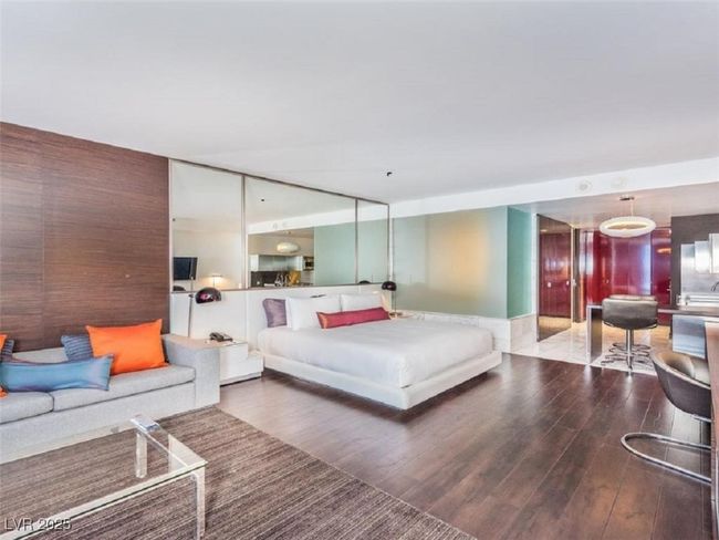Bedroom with wood finished floors | Image 6