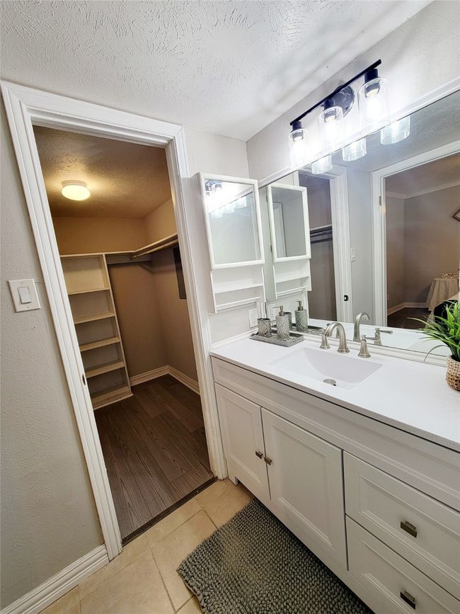 Bathroom featuring hardwood / wood-style floors, vanity, and a textured ceiling | Image 16
