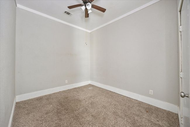 Carpeted spare room with a ceiling fan and baseboards | Image 7